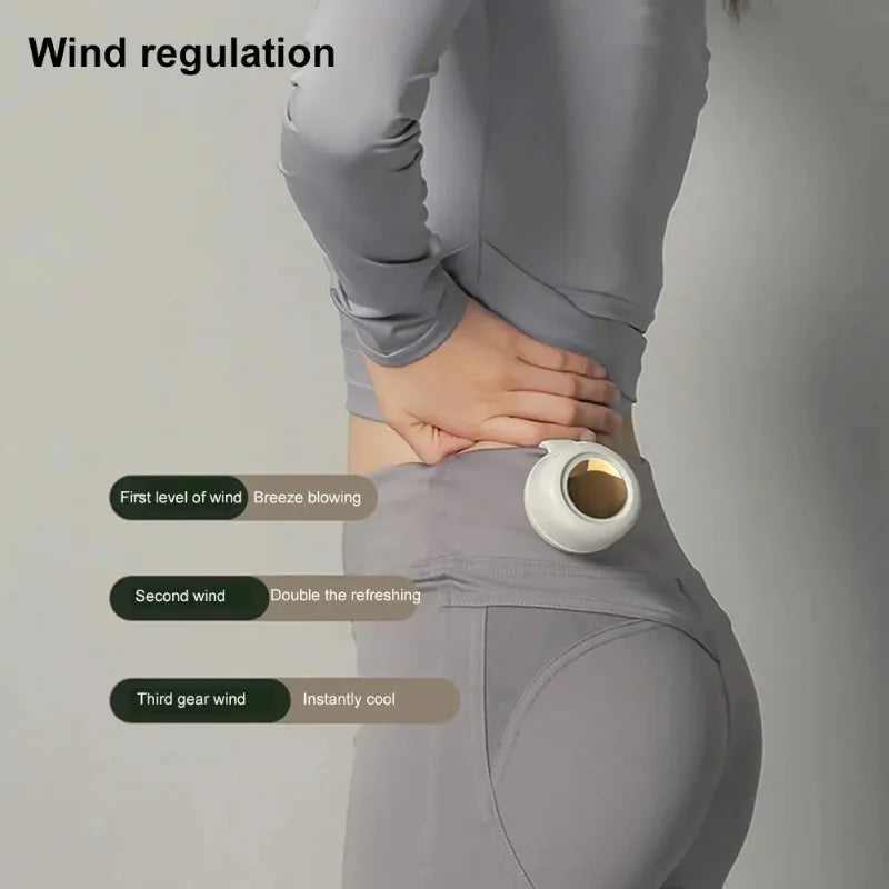 White bladeless waist-mounted fan held against a person’s lower back