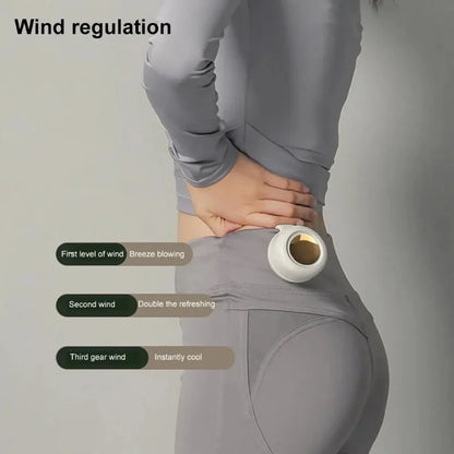 White bladeless waist-mounted fan held against a person’s lower back