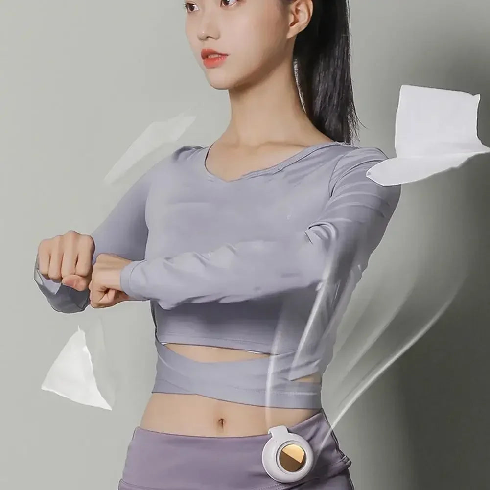 Gray bladeless waist fan clipped at the waist with airflow over the torso