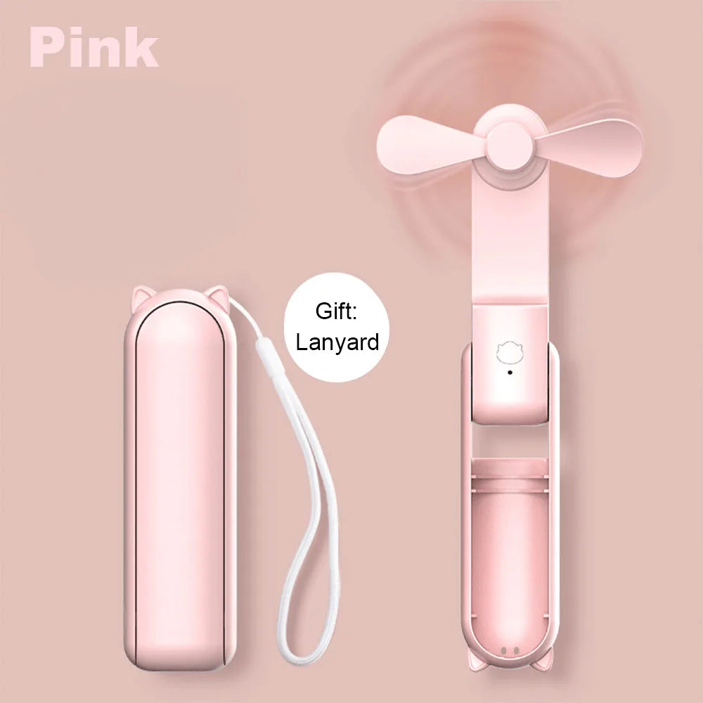 Pink foldable portable fan with three-blade head and included lanyard