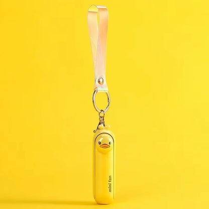 Yellow mini handheld keychain fan with ribbon strap and metal key ring, hanging view.
