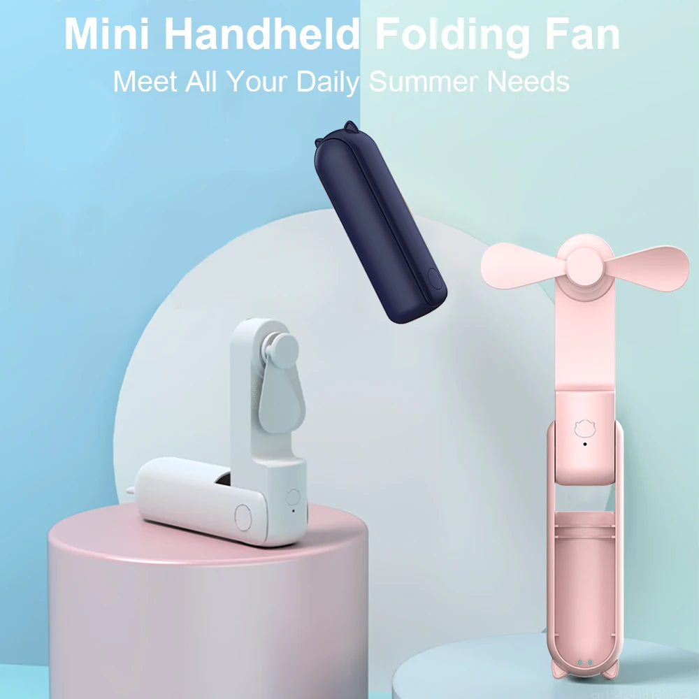 Navy and pink mini handheld folding fans with three-blade heads