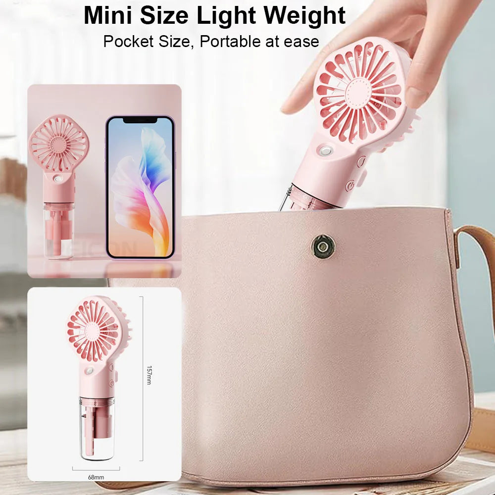 Pink pocket-size handheld mist fan with mist nozzle and transparent tank