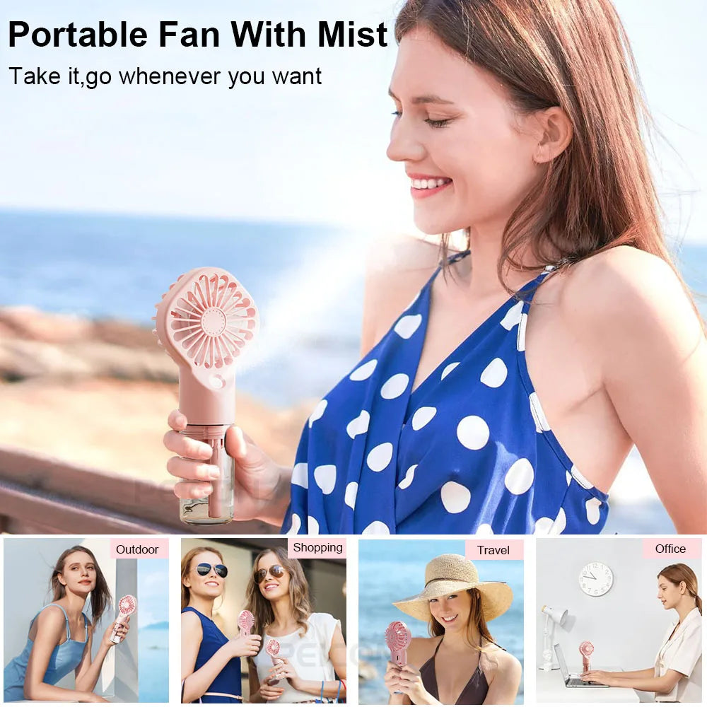 Pink portable mist fan held in hand with fine spray visible from the nozzle
